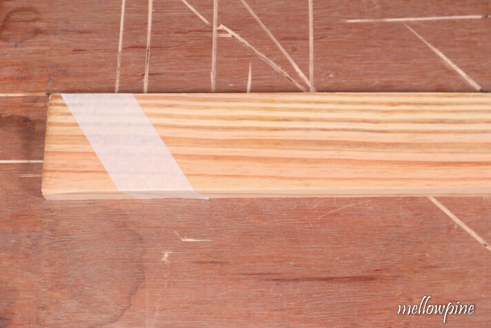fix masking tape on the wood to be cut