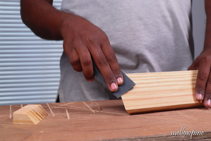 sanding the wood piece