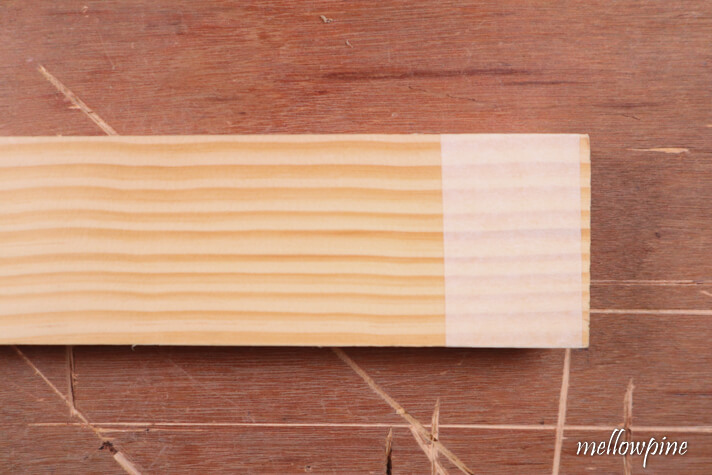 fixing masking tape on the wood