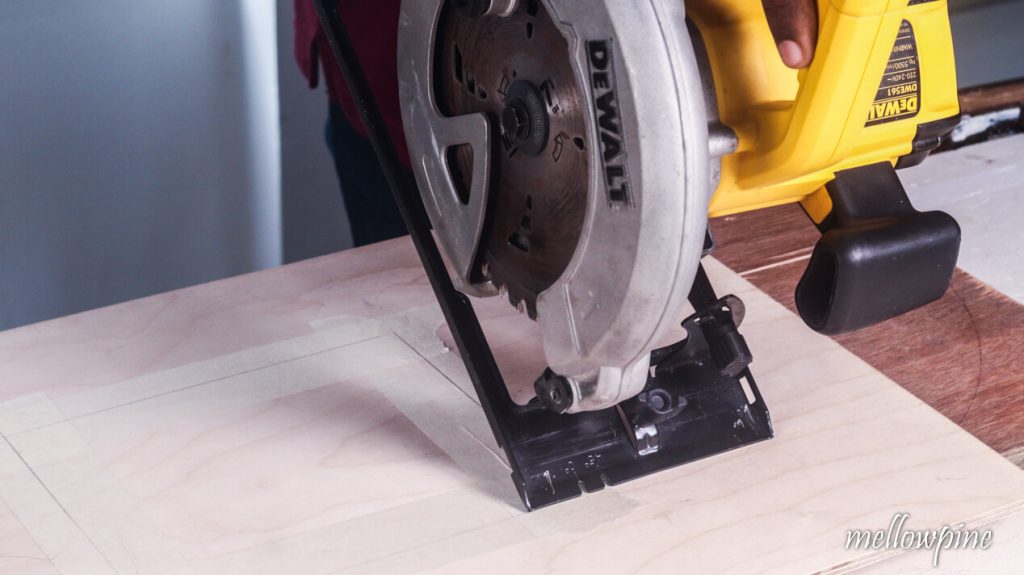 Saw inclined to wood with shoe touching