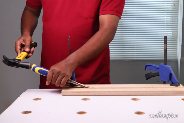 removing the cut up wood using a chisel
