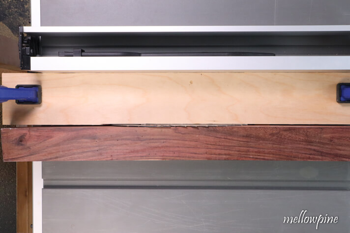 placing the wood for squaring on the table saw