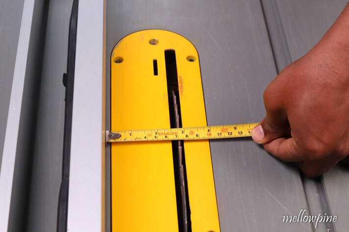 setting the rip fence for cutting the other edge of the groove