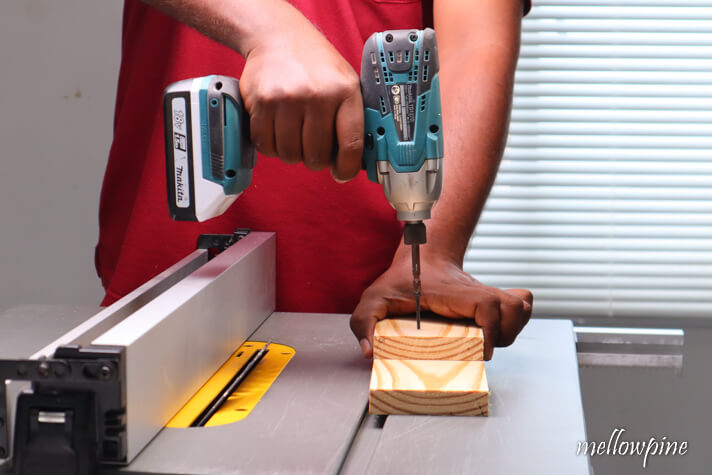 attaching the scrap wood to the wood to be bevel cut