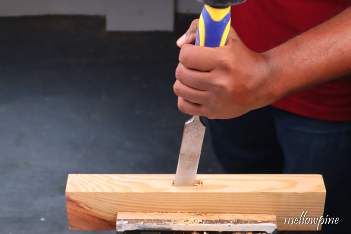 finishing the mortise using a hammer and chisel