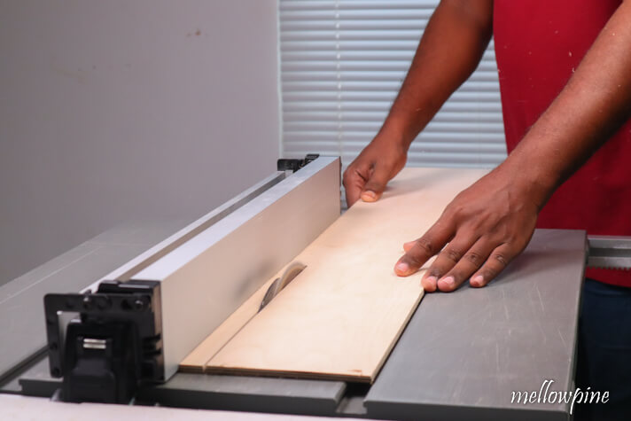 Cutting wood by force-feeding it to the table saw blade