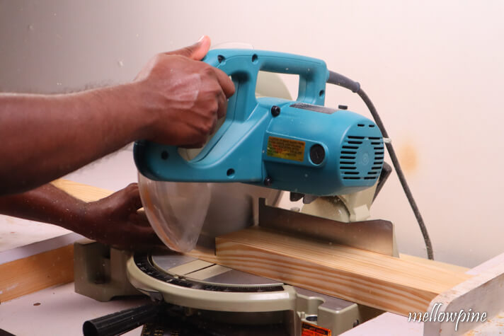 using the miter saw to size four pieces of each length