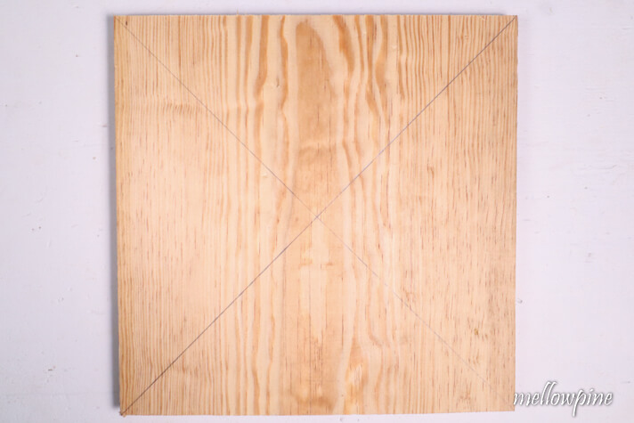 drawing diagonals to locate the center of the board