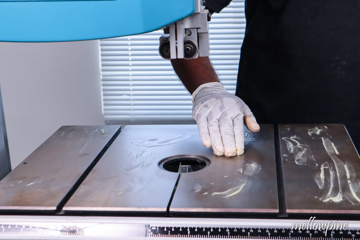 applying paste wax on the band saw table