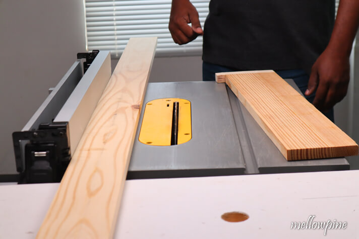 spacer board placed between the rip fence and the wood to be taper cut
