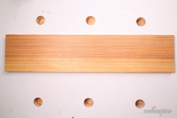 wood with bow on one side
