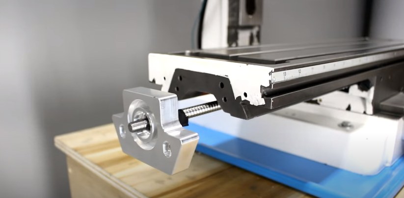 Ball screw under the saddle for workbed movement in CNC mill