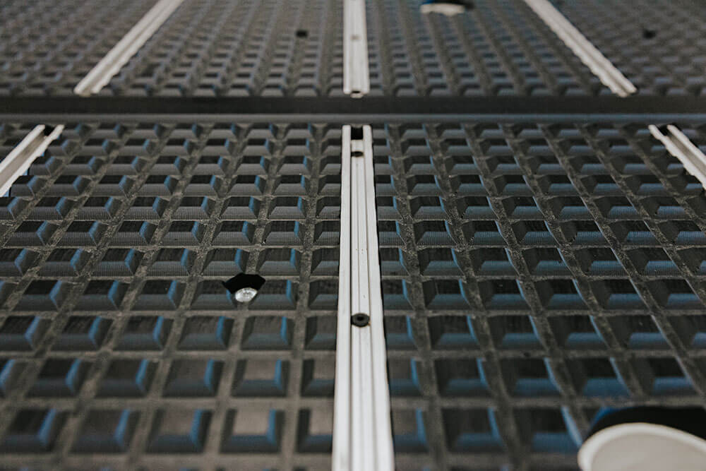 Table top with hybrid T-slots