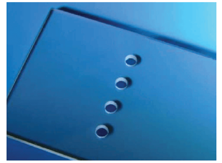 Holes made in soda lime glass with a UV laser