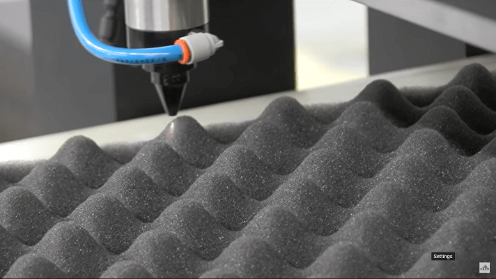 Laser cutting a thick wavy foam sheet