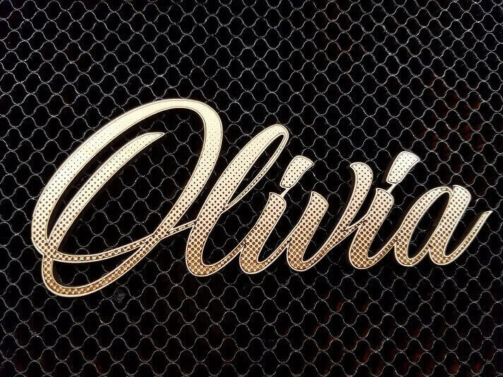 A name laser cut using Glowforge