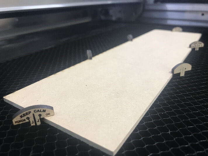 Honeycomb bed down-pins for holding the job (Source Glowforge Community)
