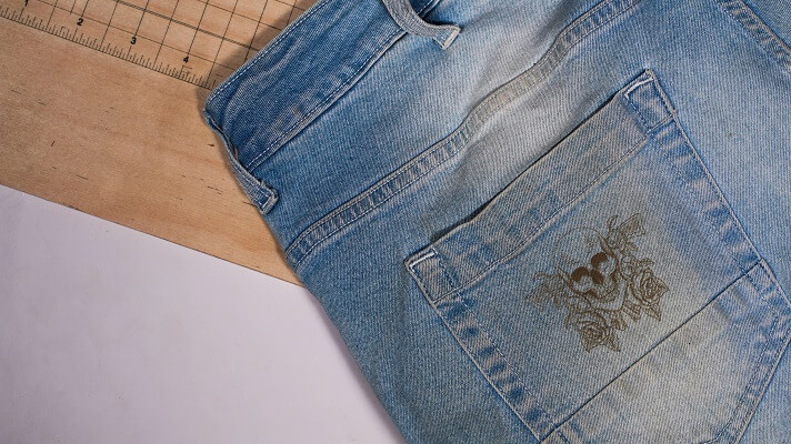Laser engraved pattern on denim jeans