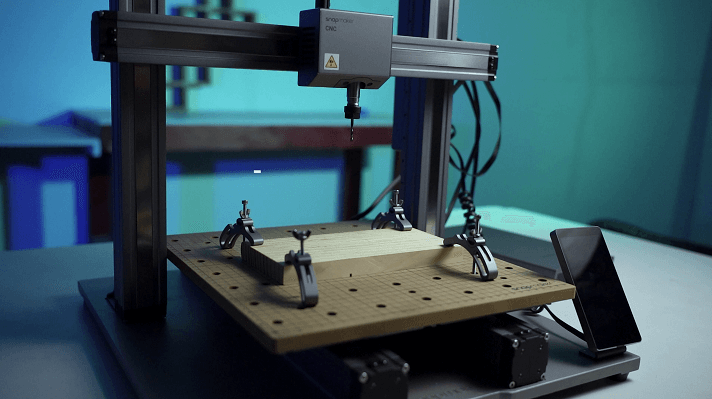 A workpiece clamped to the workbed of Snapmaker 2.0