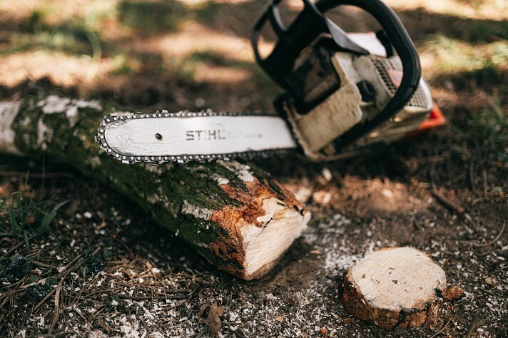 Cutting wood in a slumbering position
