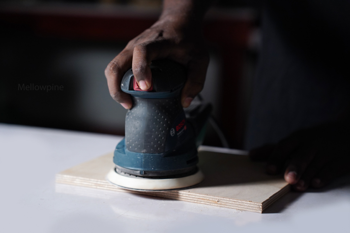 Sanding plywood using a power sander
