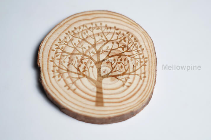 A wooden coaster engraved on TwoTrees TS2