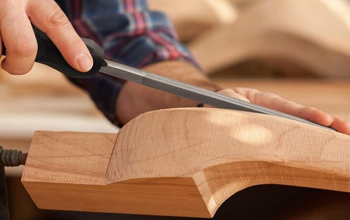 Carving wood with a file