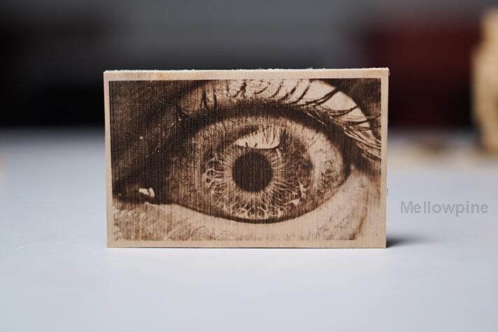 Laser engraving on wooden workpiece