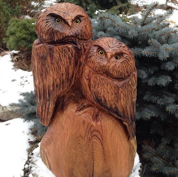 Owl sculpture carved on red oak