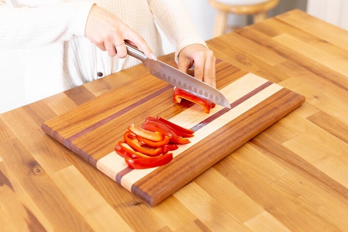Slicing vegetable on a edge grain cutting board