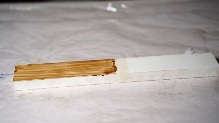 Danish oil applied over a painted pine wood piece