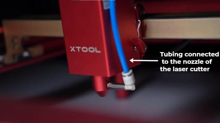 Air tubing connected to the laser nozzle