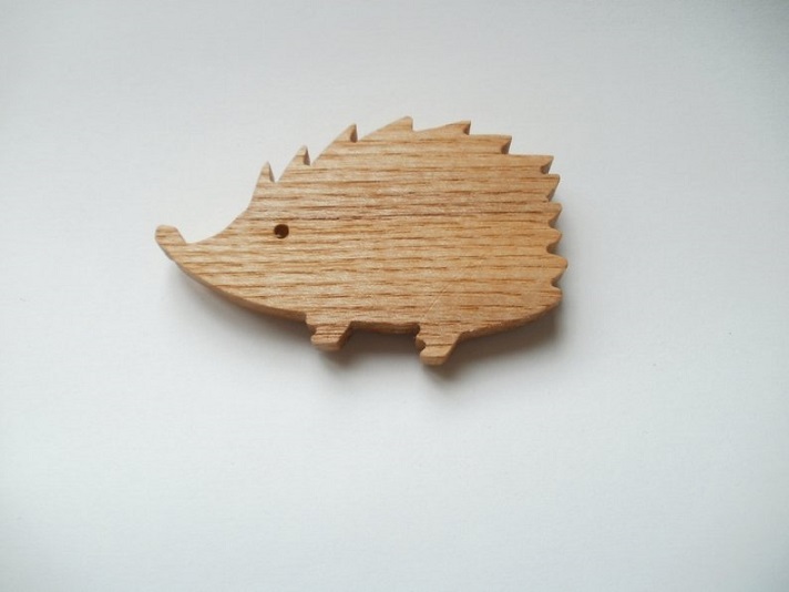 Hedgehog shape scroll sawed from ash wood