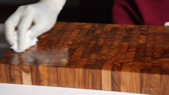 Applying tung oil on a butcher block