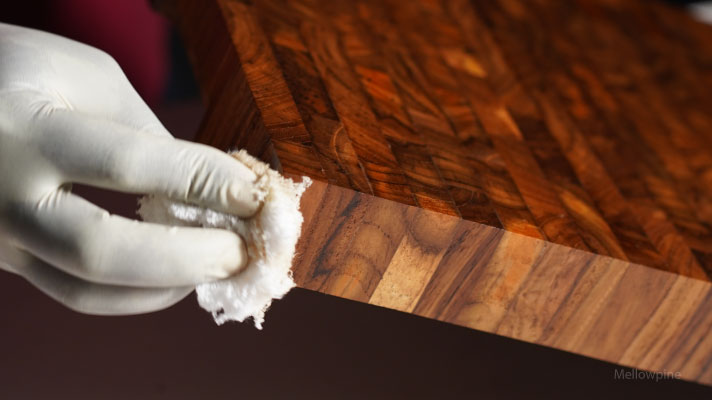 Applying tung oil on a butcher block