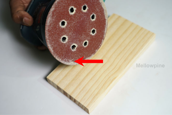 Dust sticking on a sandpaper after dry sanding wood