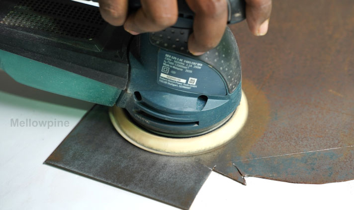 Sanding a metal sheet