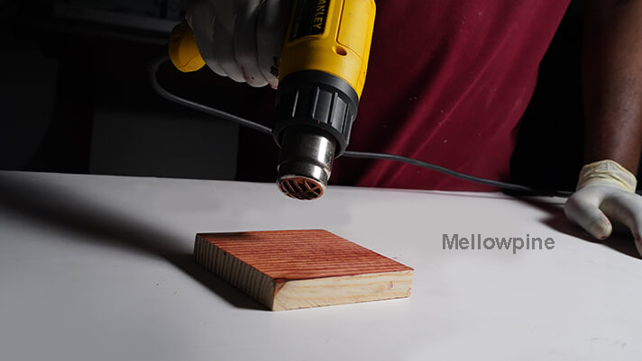 Using a heat gun to dry the stain