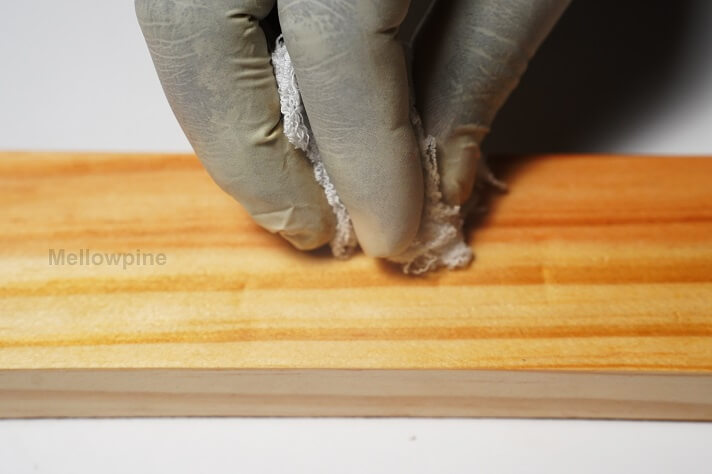 Applying additional coats of Tung Oil using a lint-free cloth