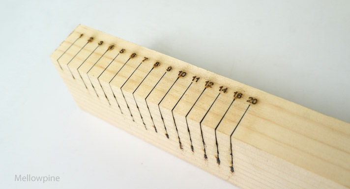 Test cuts on a 2.5" pine wood at varying numbers of passes