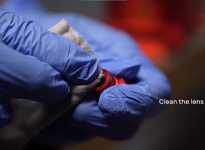 Cleaning the lens of a diode laser