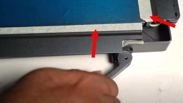 Padding along the sides used to tighten the screen printer's screen