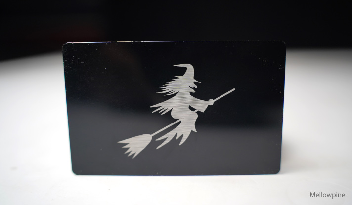 An anodized aluminum business card engraved using xTool S1