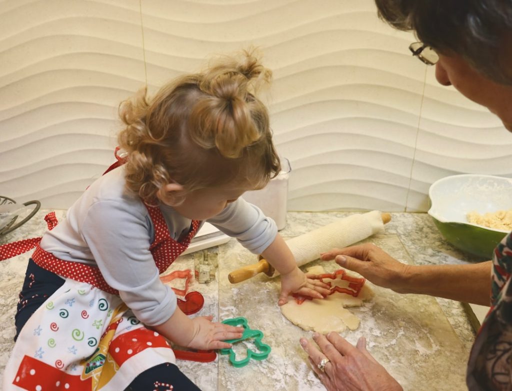 Grandkids making pizza together